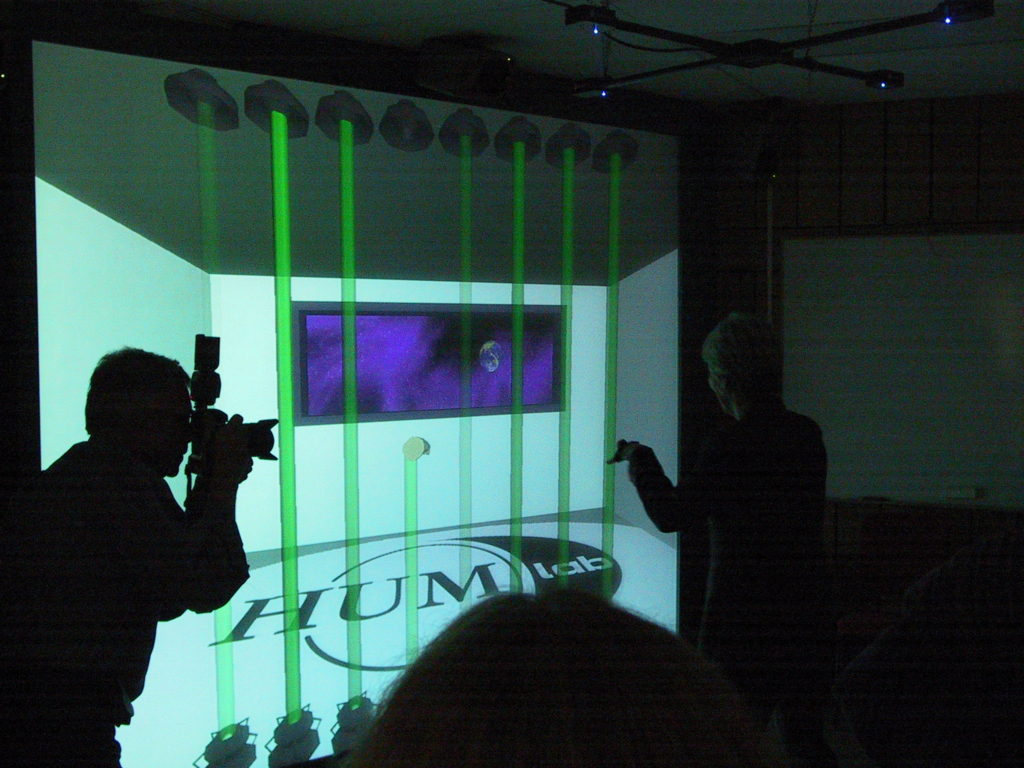 University Chancellor Sigbrit Franke playing the laser harp inaugurating the new stage of lab development in 2001. 